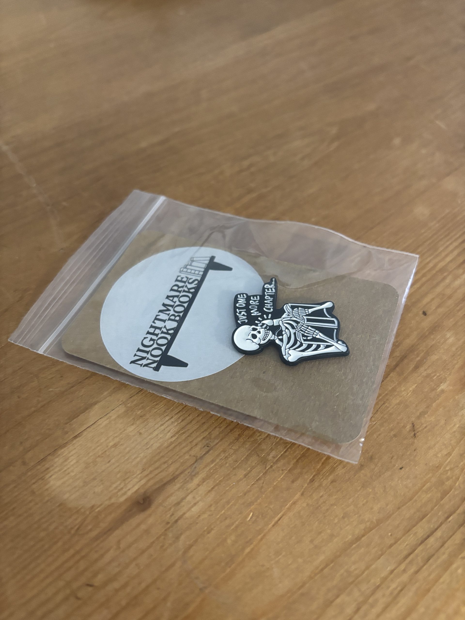 Just One More Chapter Skeleton Enamel Pin sealed