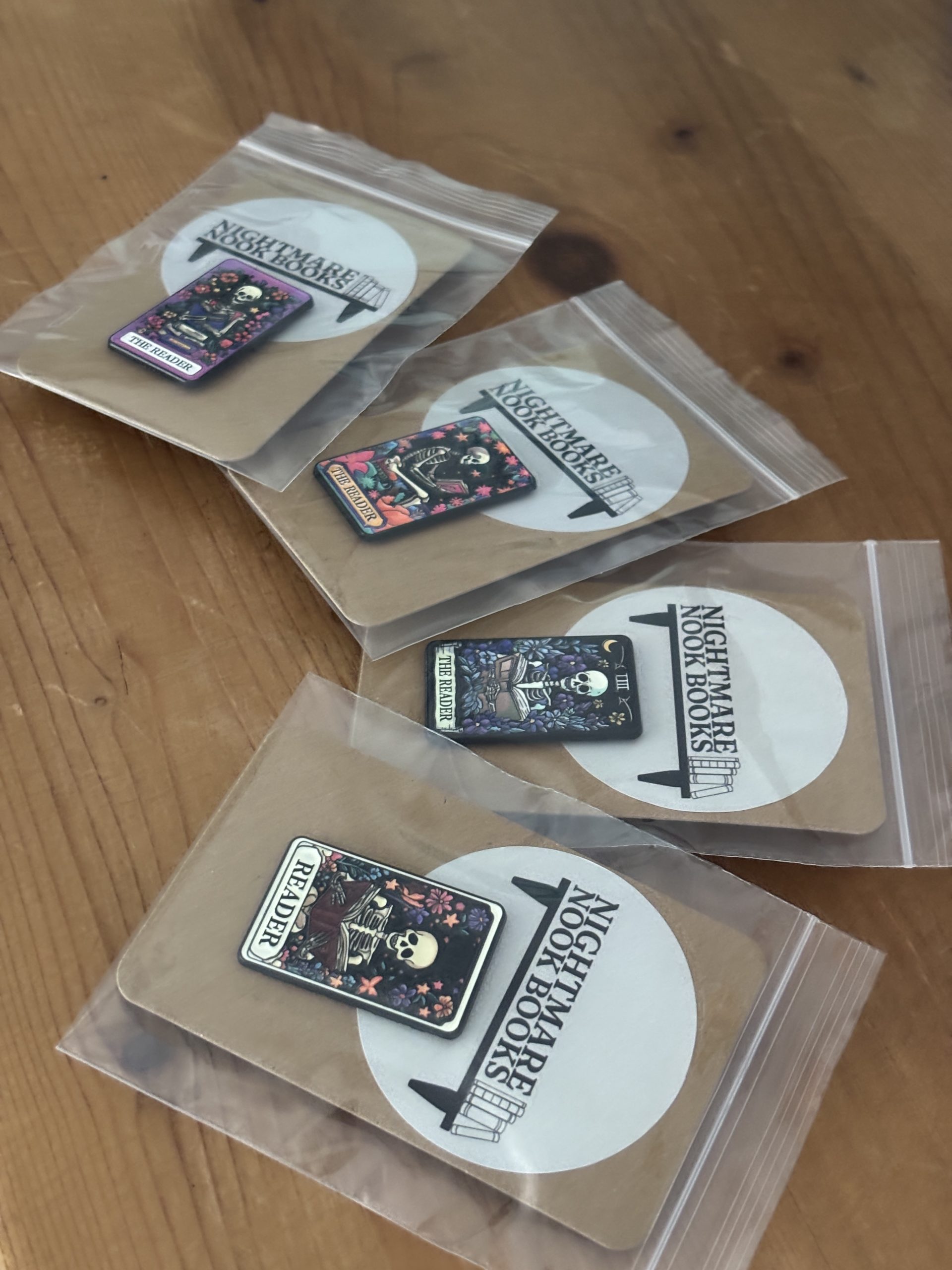 The Reader Skeleton Tarot Enamel Pins sealed