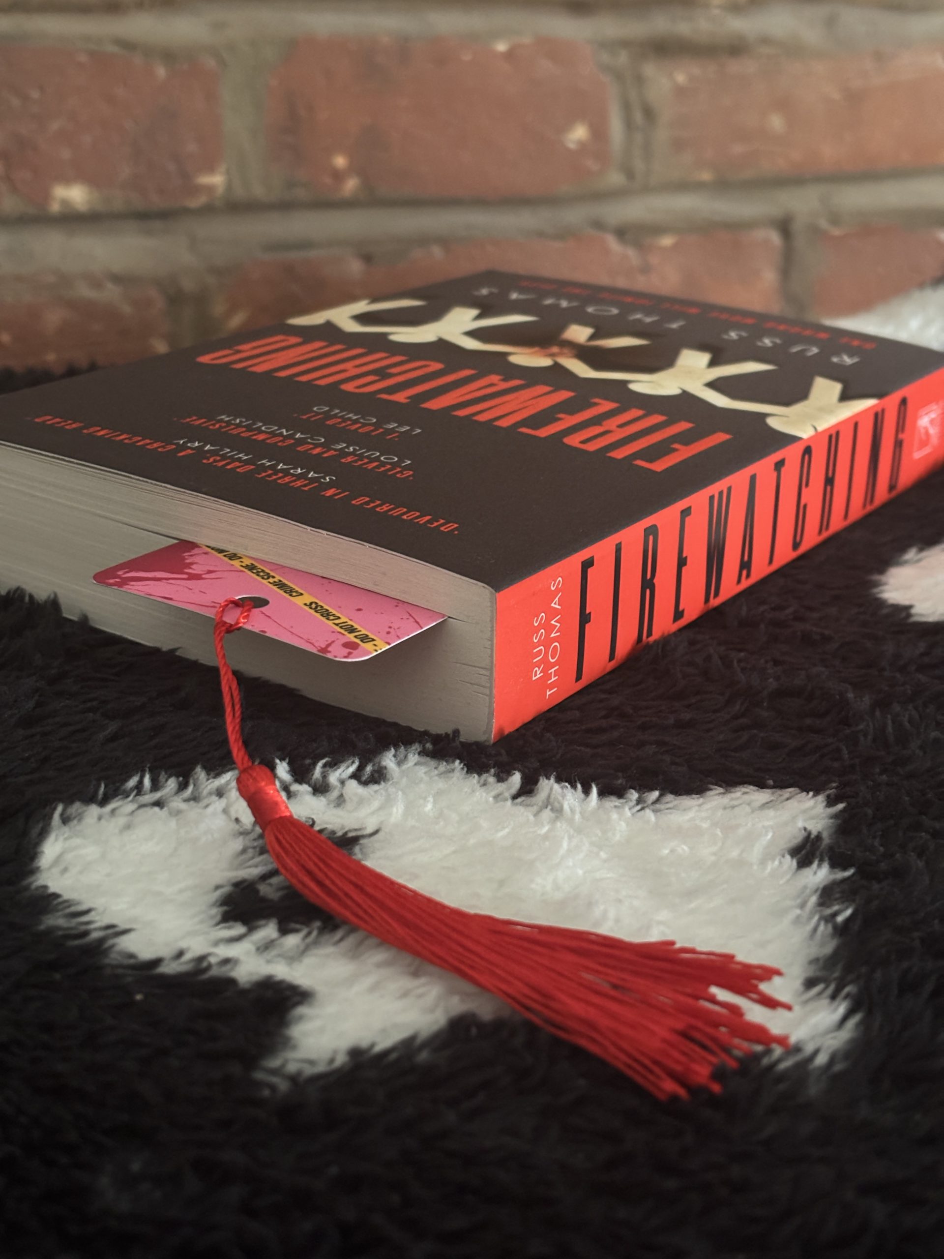 Crime scene bookmark in book