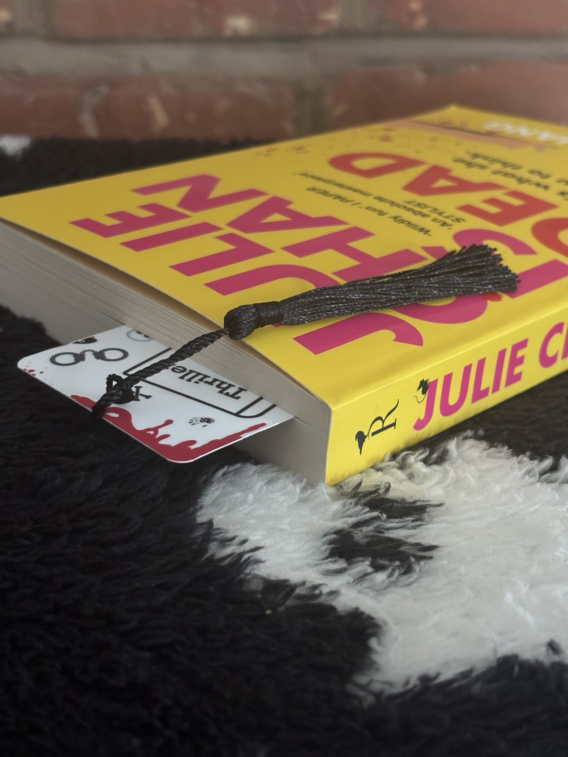 Thriller bookmark in book