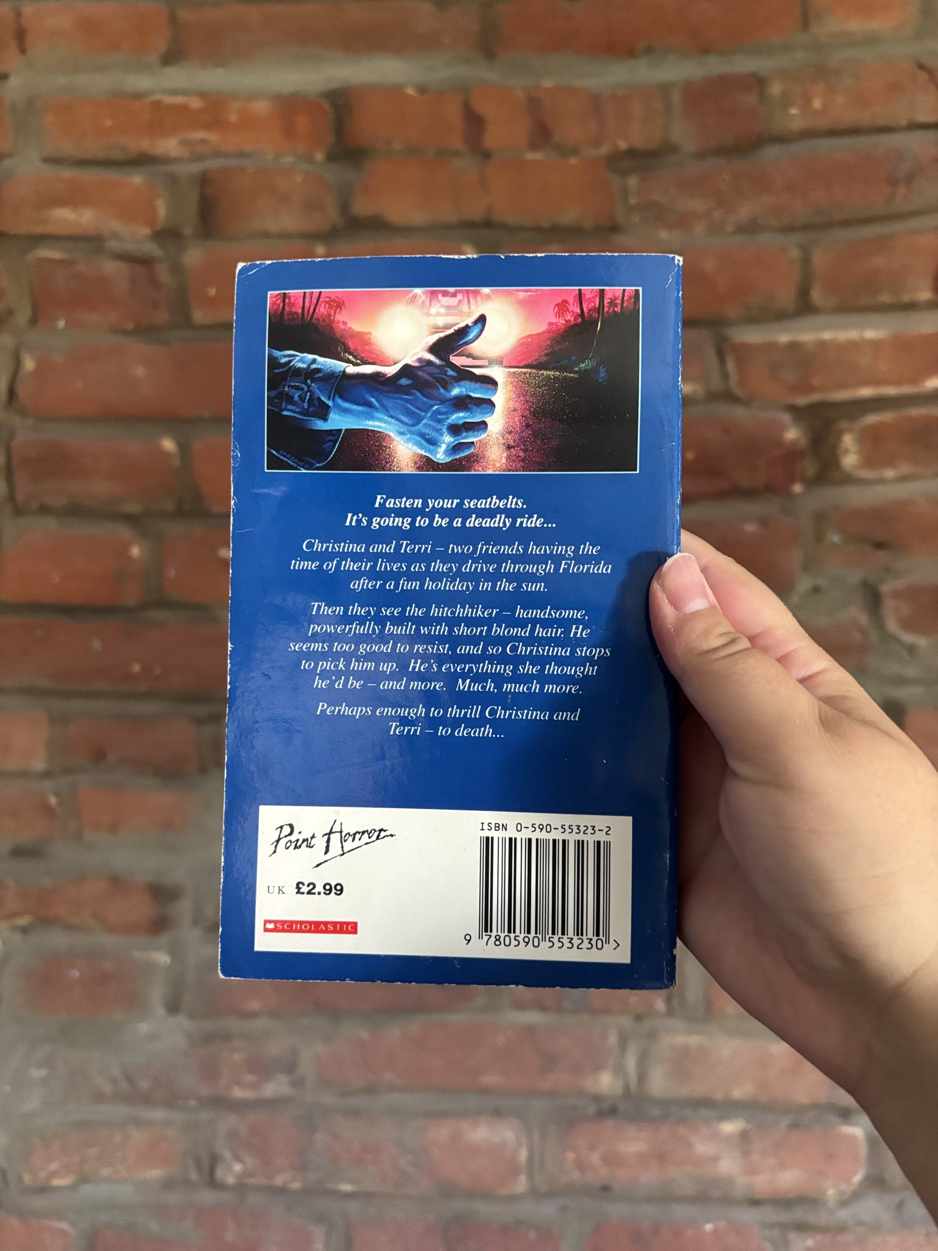 Back cover of R.L. Stine’s The Hitchhiker Point Horror book showing description and publisher details
