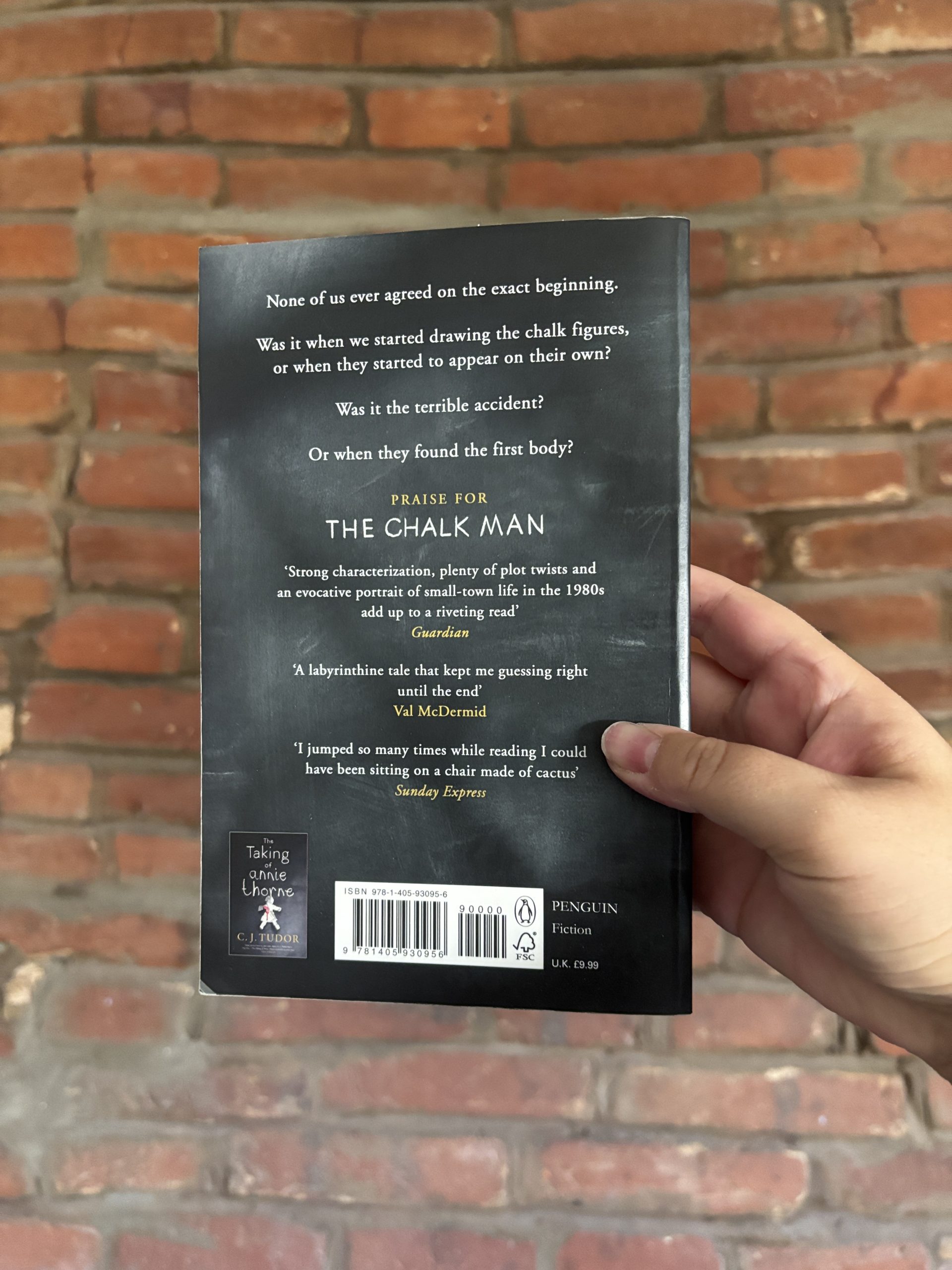 Back cover of The Chalk Man by C.J. Tudor showing book description and publisher details