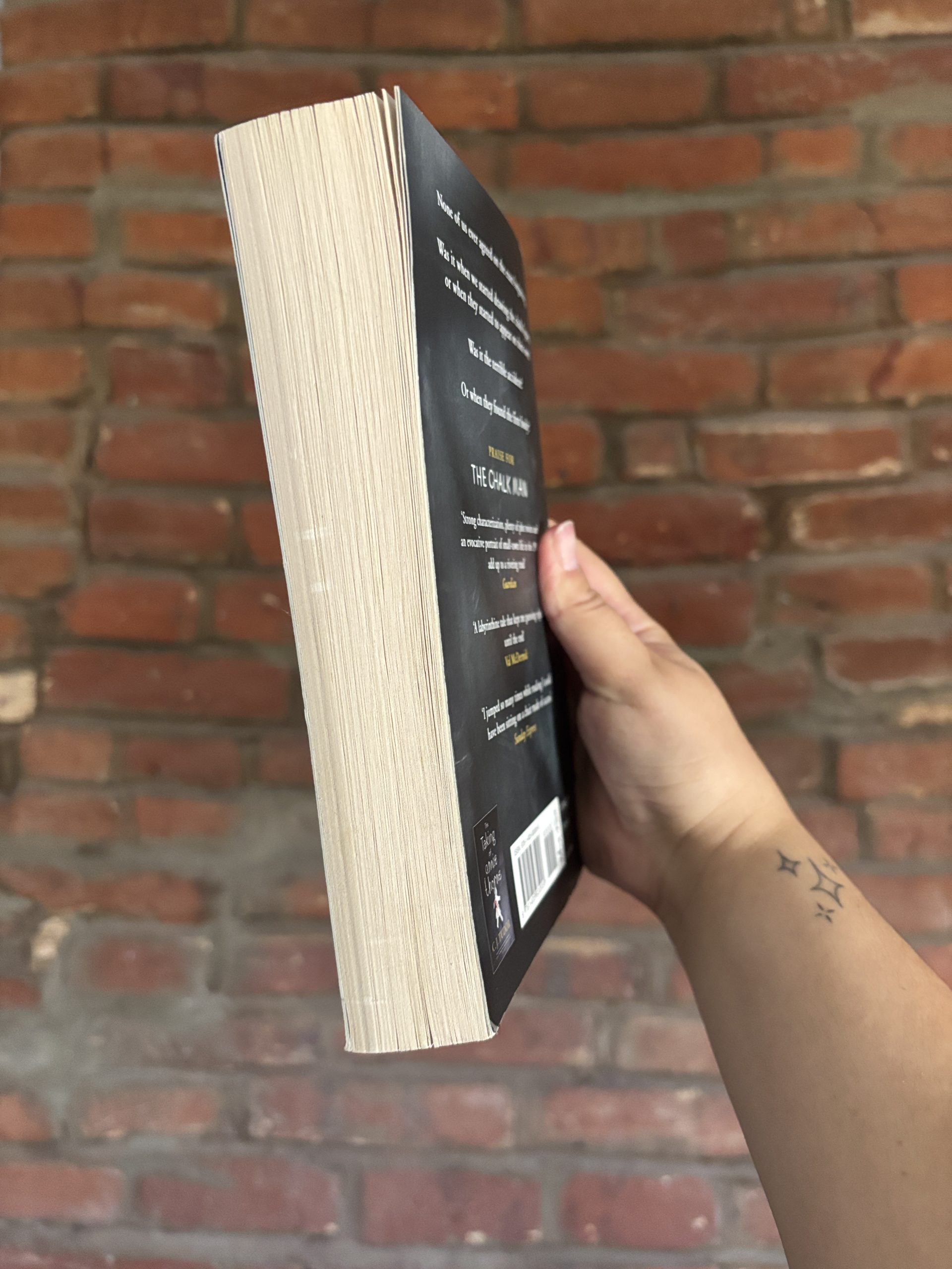 Angled view of C.J. Tudor’s The Chalk Man paperback book edge
